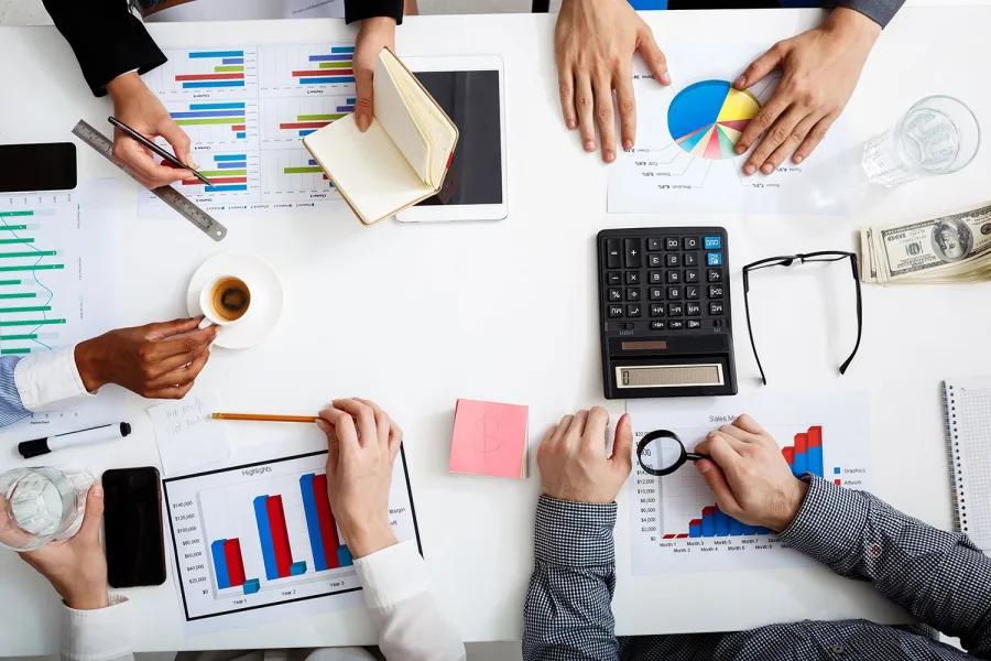 Business owners reviewing financial documents at a table